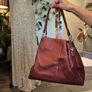 Metallic Wine Coach Handbag with animal print detail on handles